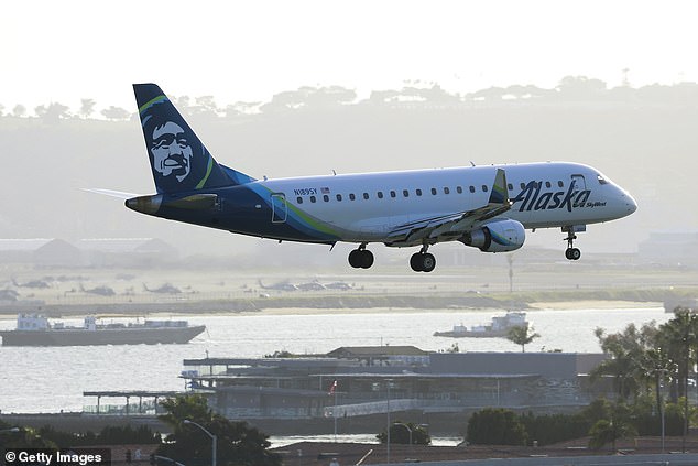 An Alaska SkyWest Embraer E175LR aircraft approaches San Diego International Airport to land on a flight from San Francisco on March 12, 2024.