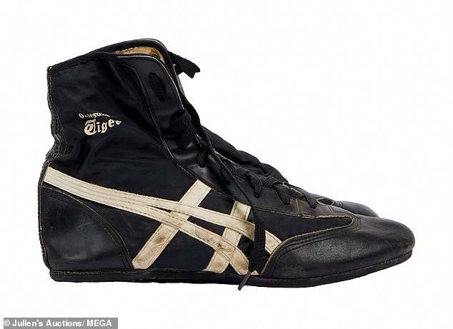 A pair of black nylon high-top sneakers from the Onitsuka Tiger brand, owned by late Queen frontman Freddie Mercury, is among the items in the lot.