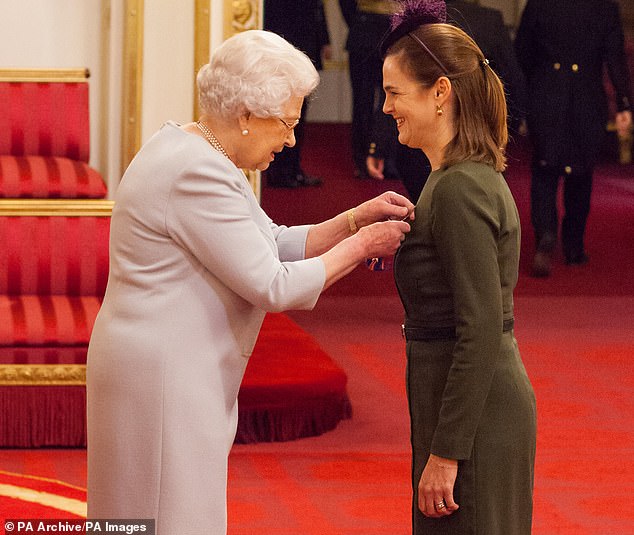 The Queen honors Samantha Cohen by naming her a Commander of the Royal Victorian Order at a ceremony at Buckingham Palace in November 2016.
