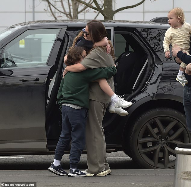 Sam seemed excited as she hugged her older children goodbye.