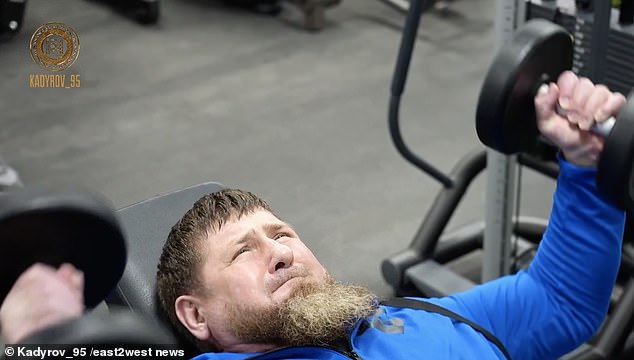 Chechen warlord and key Putin ally Ramzan Kadyrov, 47, in a gym with his top acolytes in a bid to prove he is healthy.