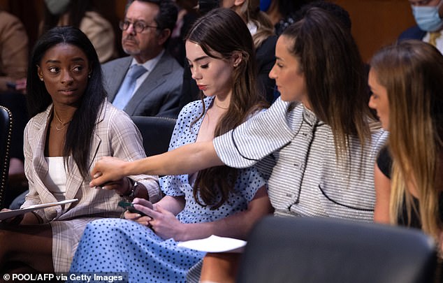 In 2021, Simone Biles, McKayla Maroney, Aly Raisman and Maggie Nichols (left-right) arrive to testify at a hearing about the FBI's handling of sexual assault allegations against Nassar.