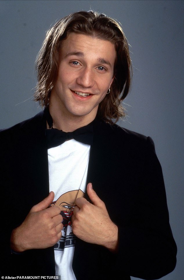 She played her love interest, Travis Birkenstock, in Clueless; seen in a 1995 promotional photo for the film.