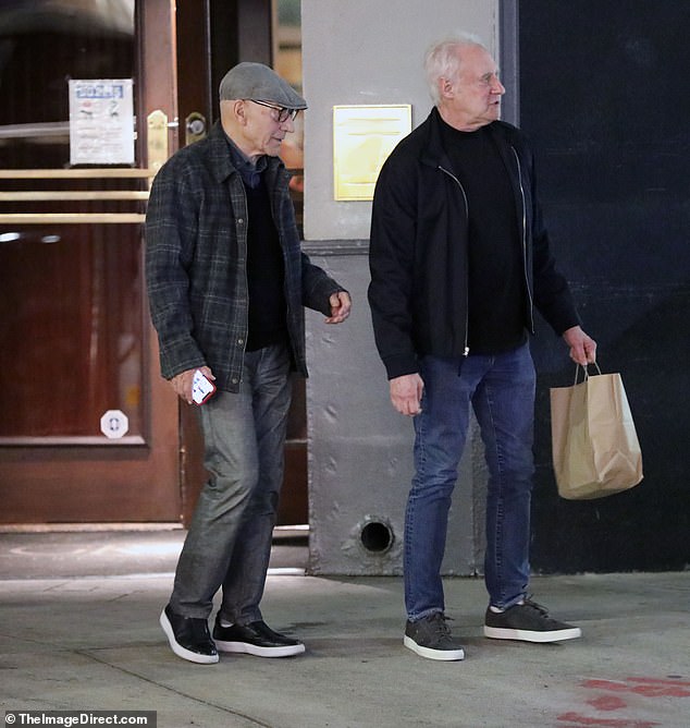 Patrick wore a gray flat cap with a dark plaid shirt and gray jeans, while Brent opted for a black jacket over a matching sweater and blue jeans.
