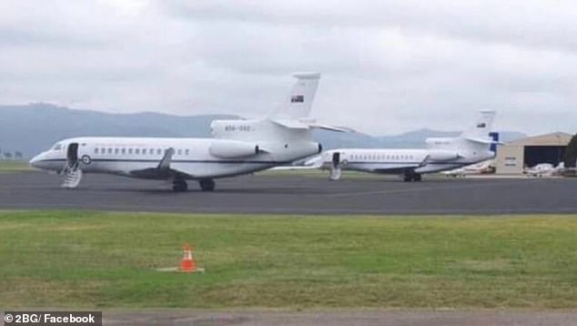 An eagle-eyed local revealed two Royal Australian Air Force planes waiting on the tarmac at Scone Airport on Thursday, sparking the saga (pictured).