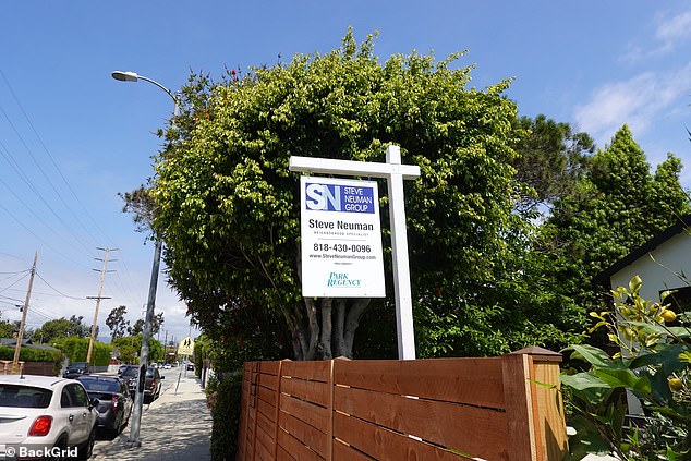 A picture of a real estate agent was displayed next to a fence at the property in Mar Vista, California.