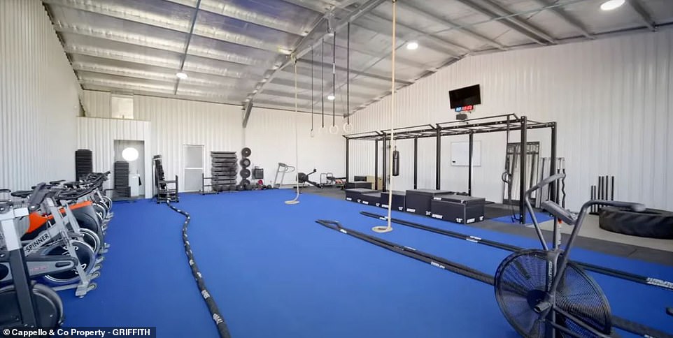 The impressive home sits on a 10,000 square meter lot and also features a huge multi-purpose shed that is almost the size of the main residence and is currently configured as a CrossFit gym.