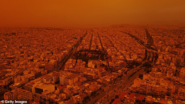 World-famous tourist sites took on a unique look after the dust cloud swept over the capital (pictured, from above)