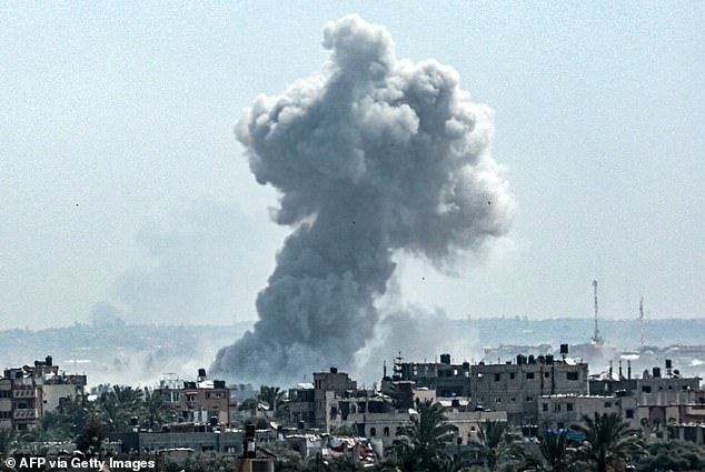 A column of smoke rises after the Israeli bombardment north of Nuseirat, in the central Gaza Strip, on April 23, 2024.