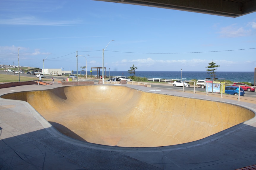 A large skate bowl with the ocean in the background.