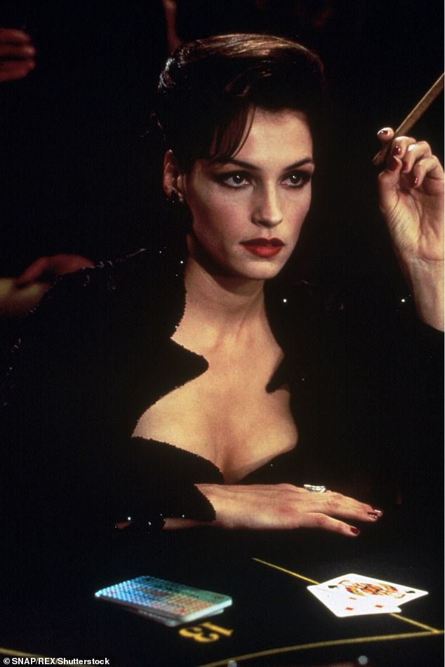 She starred in the James Bond film GoldenEye alongside Pierce Brosnan in 1995; photographed in a film still