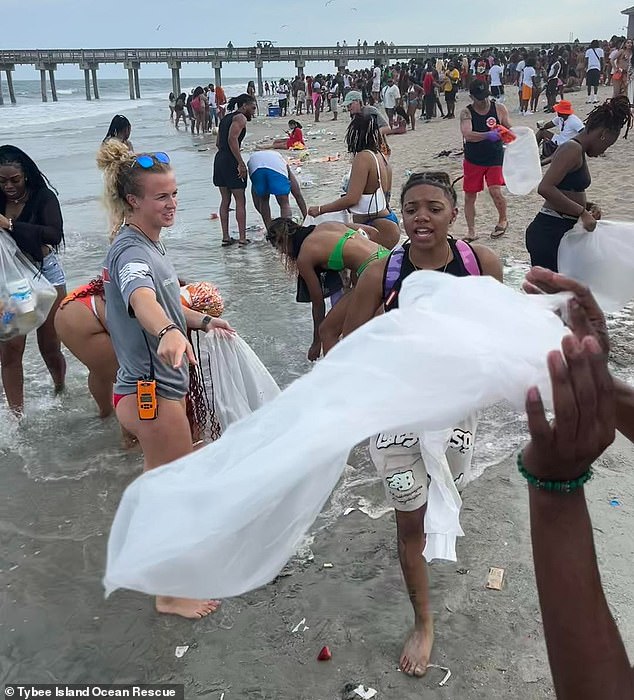 Tybee Island lifeguards and some Orange Crush attendees gathered on the beach Sunday morning to begin cleaning up the beach, which was trashed during the event.