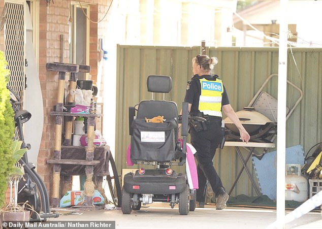 An unattended wheelchair and cat scratching post could be seen in Mrs Bates' driveway.
