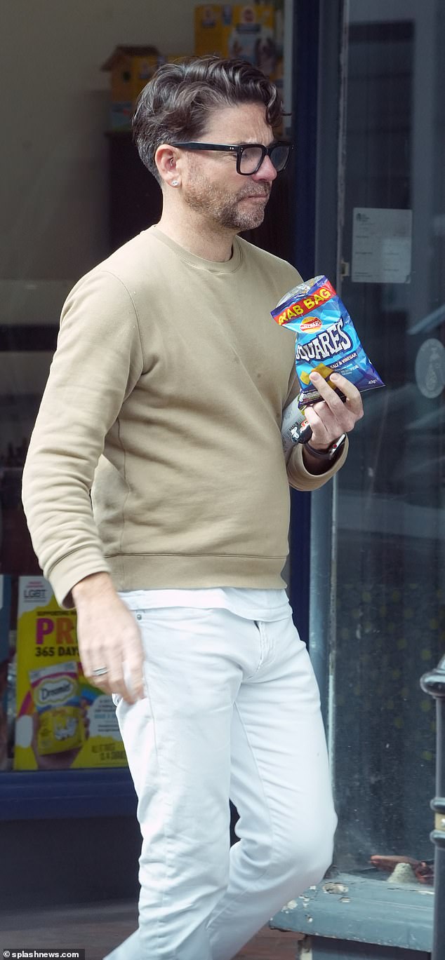 Daniel was seen heading to a nearby store to buy a snack during a day of work at the salon.