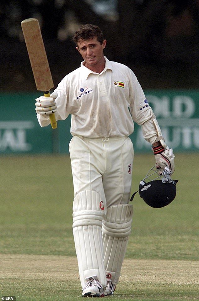 Zimbabwe batsman Guy Whittall celebrates after scoring his fourth Test century in 2001.