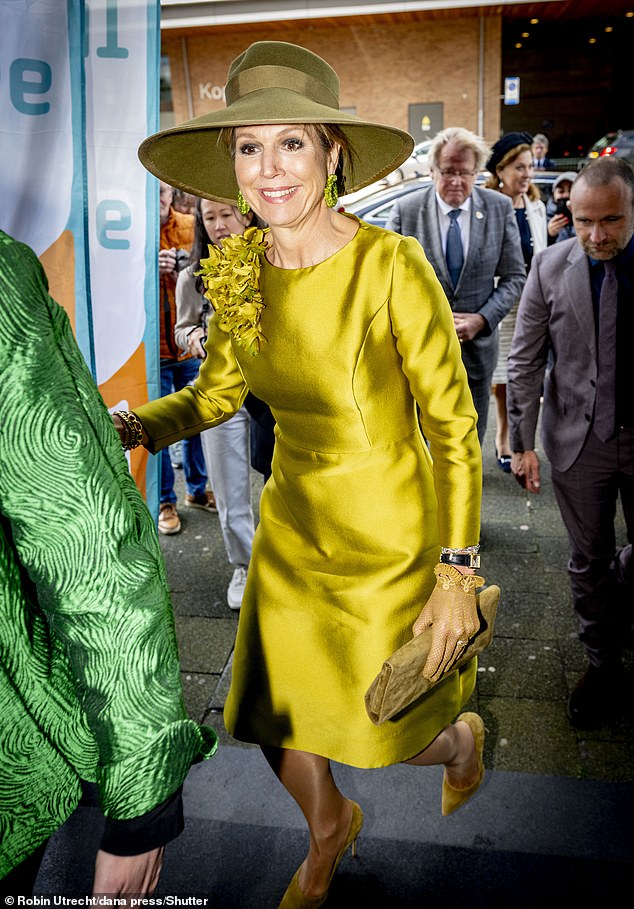The royal donned a striking gold shift dress from Natan Couture with a large ruffle embellishment on the shoulder.
