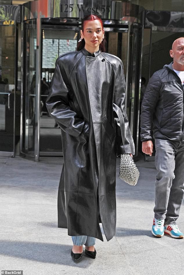 The 28-year-old singer, who is promoting her new album, wowed with the long coat that featured striking shoulder pads.