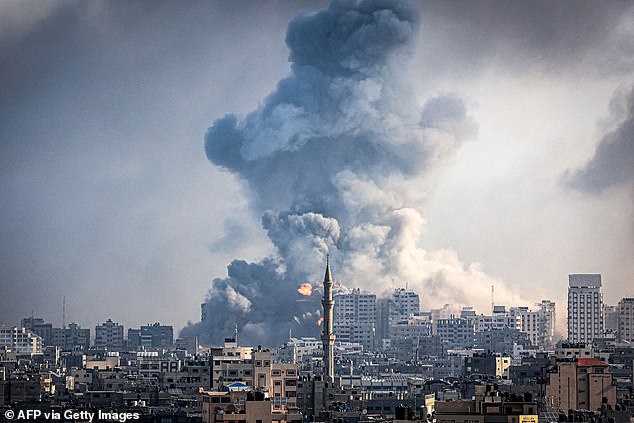 Plumes of smoke rise during Israeli airstrikes on Gaza City on October 12, 2023.