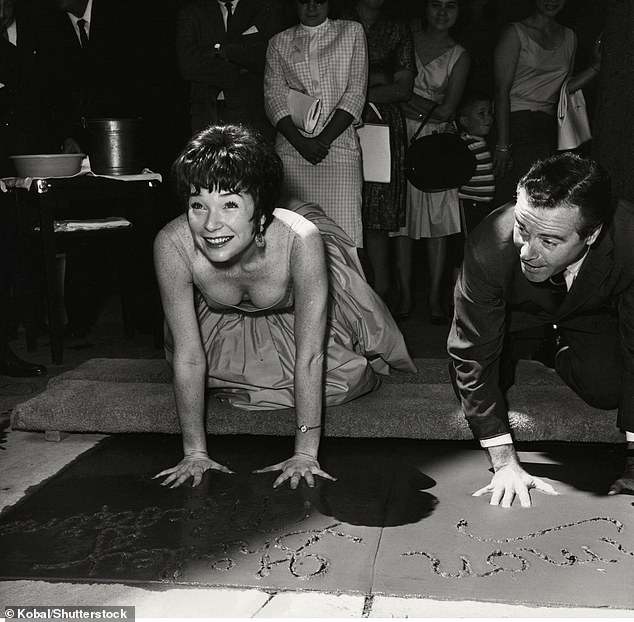 The actress and Jack Lemmon, her co-star in Billy Wilder's The Apartment, left their signature and handprints in cement outside Grauman's Chinese Theater in 1964.