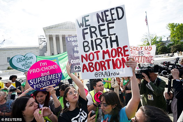 Protesters for and against abortion rights clash outside the Supreme Court ahead of Wednesday's arguments.