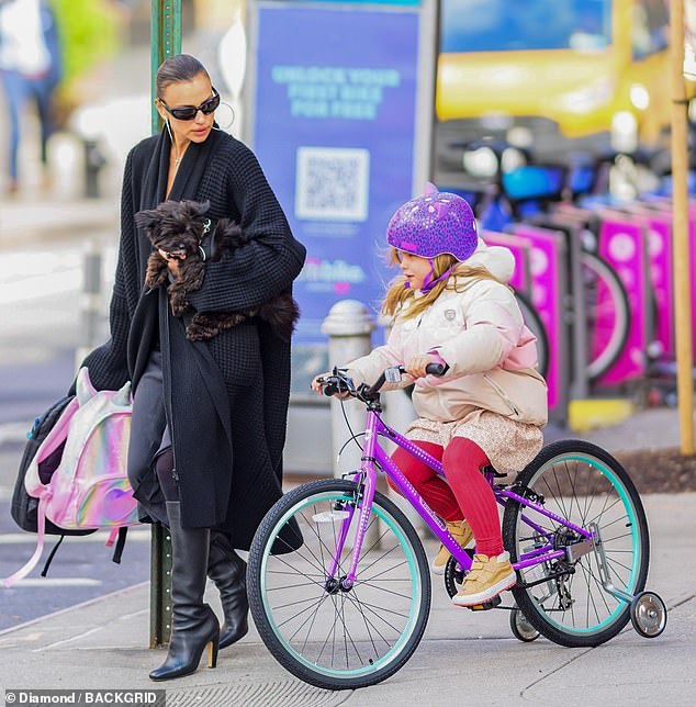 Irina shares 50/50 joint legal and physical custody of her seven-year-old daughter Lea De Seine Cooper (right, pictured April 4) with her ex-fiancé Bradley Cooper, and they do not employ babysitters.