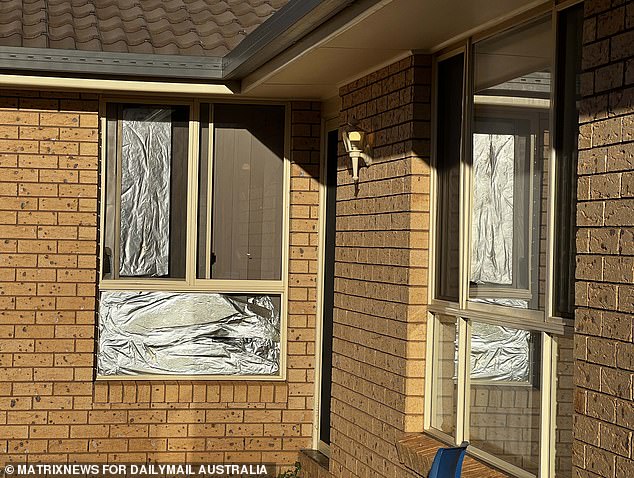 The windows of Daniel Billings' home were covered with aluminum foil to block the sun.
