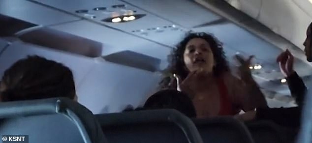 On a Frontier flight, a woman berated another passenger before being restrained