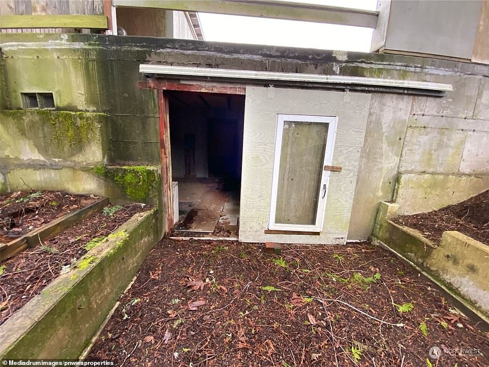 The two-bedroom property is located in a secluded area in Port Orchard in Manchester, Washington, and has the perfect feature for those worried about the end of the world: an apocalyptic bunker.