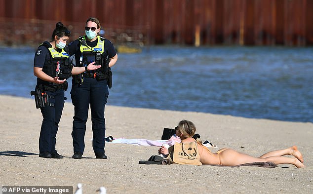 Going to the beach was illegal during Victoria's lockdowns (pictured in St Kilda in 2021)