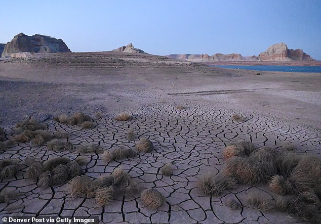 In an area near Wahweap Marina that was previously underwater in Lake Powell, the ground is dry and cracked on April 5, 2022 in Page, Arizona.