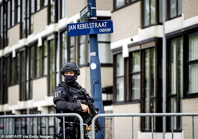Security personnel stand guard outside the court bunker in Amsterdam-Osdorp before a hearing in which Dutch drug trafficker Ridouan Taghi of Mocro Maffia received a life sentence.