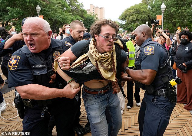 A protester detained by Texas police at the University of Texas at Austin on Wednesday.