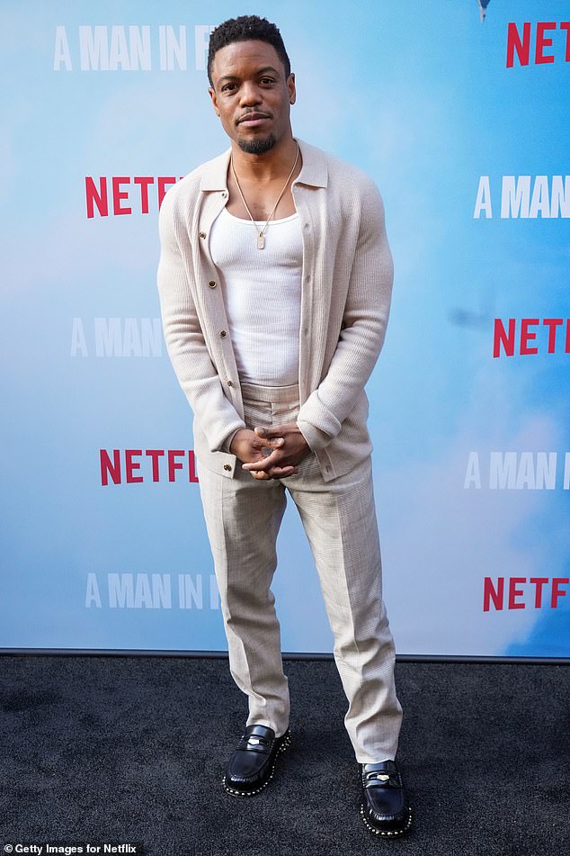 Jon Michael Hill, who plays Conrad Hensley, opted for a white tank top under a tan cardigan and matching pants with black loafers.