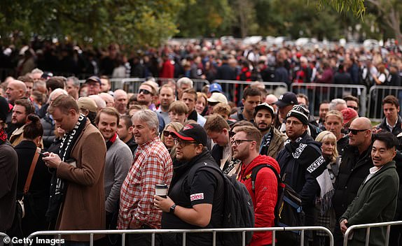 MELBOURNE, AUSTRALIA - APRIL 25: Spectators arrive for the AFL round seven match between Essendon Bombers and Collingwood Magpies at Melbourne Cricket Ground, on April 25, 2024, in Melbourne, Australia. (Photo by Robert Cianflone/Getty Images)