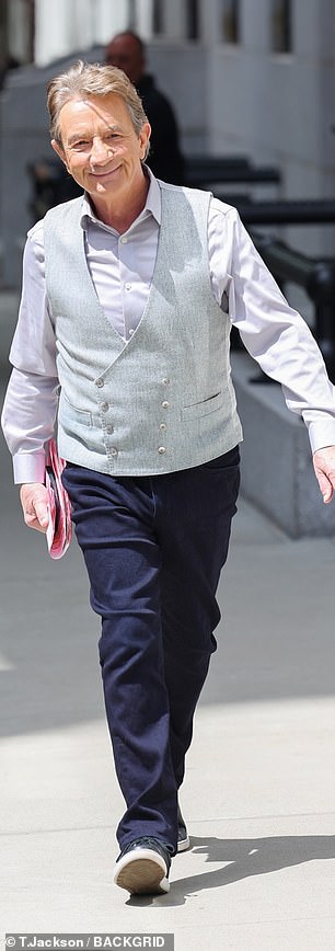 Martin, 74, was seen arriving on set looking dapper in a vest, button-down and trousers.