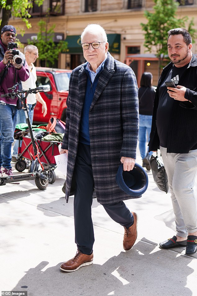 Steve Martin, 78, sported a plaid coat while wearing his hat as he arrived on set.