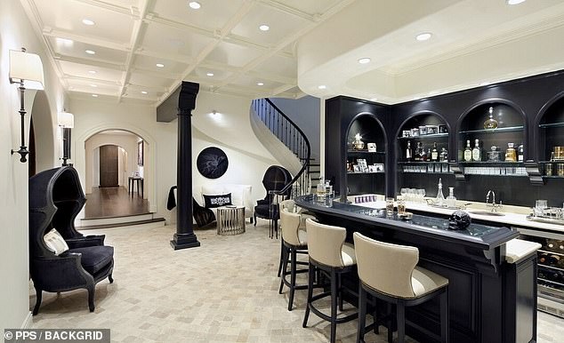 The lower level of their home features an extravagant wet bar.