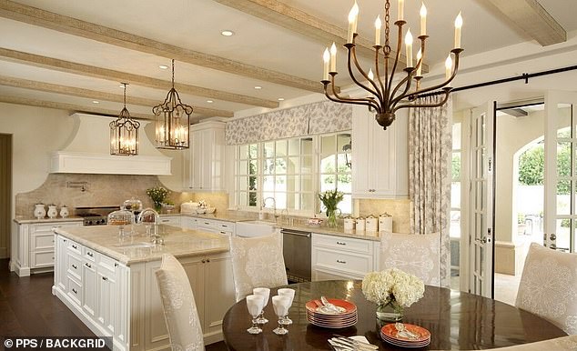 Your kitchen has a huge island with plenty of space and sunlight.