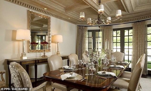 The mansion also features a stunning formal dining room perfect for entertaining.