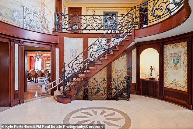 The stair railing was skillfully crafted by a Russian metal artist.