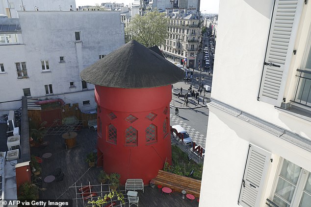 The red tower at the top of the famous Paris landmark is seen today without candles after the incident.