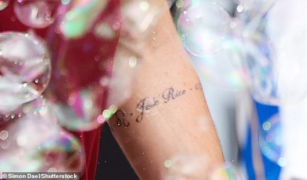 The tattoo, which circled the England international's lower left arm, revealed the name Jude, an apparent date of birth and a quote.
