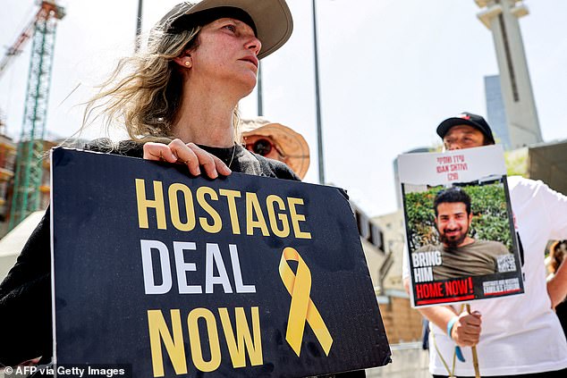 Relatives of Israeli hostages held in Gaza since the October 7 attacks by Palestinian militants and their supporters protest outside the Defense Ministry headquarters in Tel Aviv.