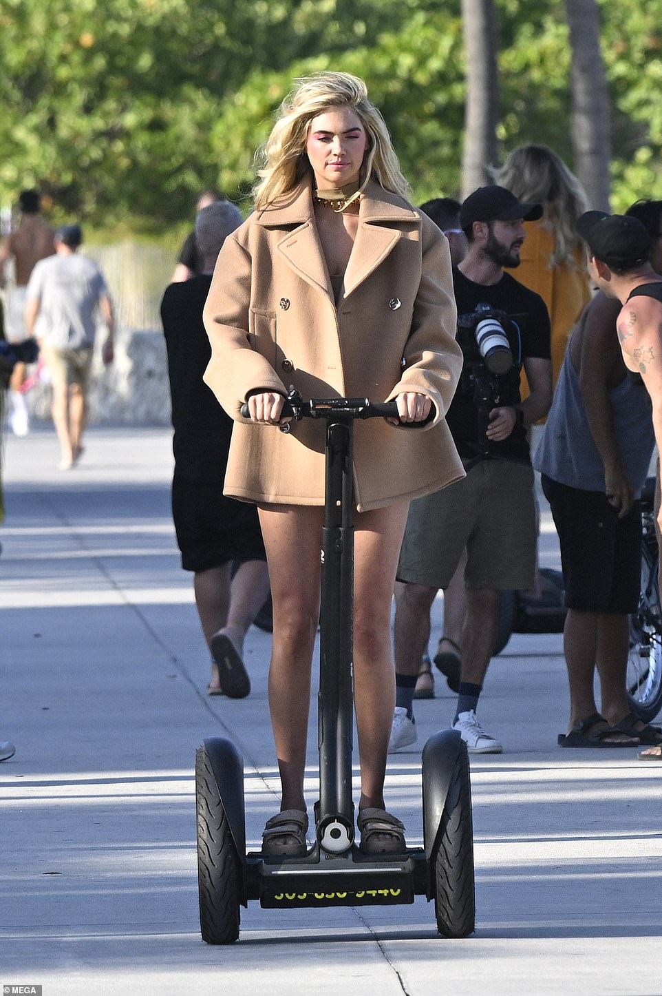 Kate was riding the Segway while wearing $1,050 Prada sandals – the padded nappa leather sandals.