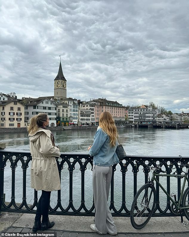 She also shared a photo of herself looking out over a lake while standing on a bridge with what appeared to be her daughter Vivian to her left.