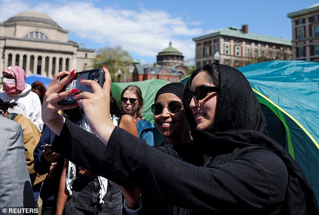 Protesters repeatedly stopped Omar to take photos with the prominent progressive.