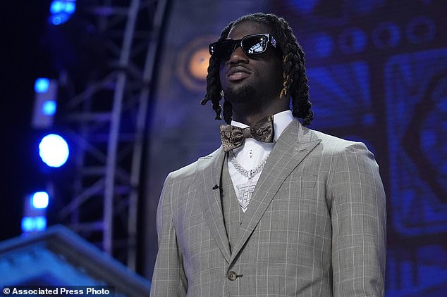 Thomas Jr. wore a gray suit, silver chain, bow tie and sunglasses on his big draft night in Detroit.