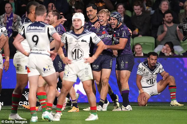 Rabbitohs players appear dejected after allowing one of the Storm's 10 tries.