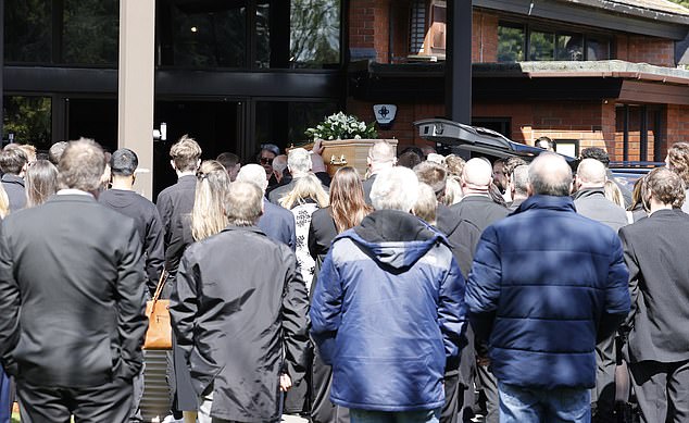 A crowd of people attended the service today where George's coffin was carried.