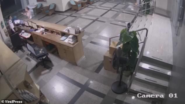 CCTV footage from inside the lobby of the apartment block shows the moment Ms Cox confronted the guard.